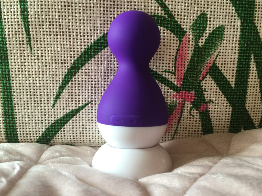 Cute Coco vibrator on charging base.