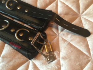 Meo Berlin cuffs lock and key.